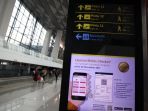 aktivitas-penumpang-di-bandara-seotta-jelang-nataru_20211220_195850.jpg