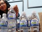 arema-cronus-resmi-memperkenalkan-produk-air-mineral-kemasan-bernama-arema-water_20160916_205755.jpg