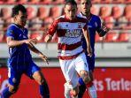 arema-fc-madura-united-jordy-wehrmann-arkhan-fikri.jpg