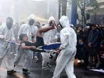 aremania-tuntut-pelanggaran-ham-berat-atas-tragedi-kanjuruhan_20221127_221313.jpg