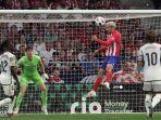 atletico-madrid-vs-real-madrid-antoine-griezmann-mencetak-gol-melalui-sundulan.jpg