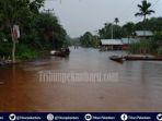 banjir-di-desa-pelalawan-riau.jpg