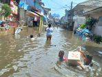 banjir-rob-masih-genangi-muara-angke_20211208_184555.jpg