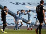 bek-inggris-manchester-city-john-stones-tengah-merayakan-mencetak-gol-kedua-timnya.jpg