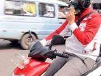 berkendara-sambil-merokok-sudah-dikenakan-undang-undang.jpg