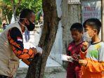 bkr-satgas-covid-19-saat-menggelar-aksi-berbagi-175000-masker.jpg