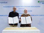 bpjs-ketenagakerjaan-roswita-nilakurnia-dan-direktur-mercato-digital-asia-indra-suryawan.jpg