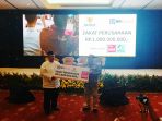 bri-syariah-salurkan-zakat-rp-1-miliar-ke-baznas_20180525_104854.jpg