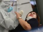 calon-penumpang-ka-st-senin-melakukan-rapit-test-antigen_20201222_133711.jpg