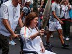 christina-assi-mengarak-obor-olimpiade-paris-2024.jpg