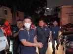 christoper-steffanus-budianto-tersangka-penipuan-mobil-jessica-iskandar-digiring-penyidik-di-polda.jpg