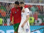 cristiano-ronaldo-dan-pemain-depan-prancis-karim-benzema-berjalan-bersama.jpg