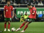 cristiano-ronaldo-melakukan-tendangan-bebas.jpg