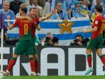 cristiano-ronaldo-selebrasi-usai-bobol-gawang-uruguay_20221129_032708.jpg