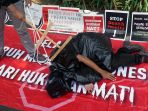demo-mengutuk-eksekusi-mati-zaini-misrin_20180320_144021.jpg