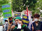 demo-penundaan-pilkada-2020-ditengah-covid-19_20200911_120413.jpg