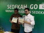 deputi-baznas-arifin-purwakananta-bersama-managing-director-go-pay-budi-ganda-soebrata_20180517_082237.jpg