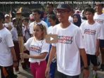 diberikan-kesempatan-memegang-obor-asian-para-games-2018_20181004_162213.jpg
