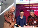 direktur-bca-suwignyo-budiman-direktur-utama-pt-ksei-margeret-m-tang_20150711_065115.jpg
