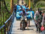 distribusi-logistik-pemilu-2024-ke-tps-terpencil-di-lampung_20240212_100320.jpg