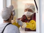 dunia-menghadapi-virus-omicron-varian-sars-cov-2-di-tahun-2022_20220107_161442.jpg