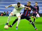 eal-madrid-asal-prancis-karim-benzema-kiri-berebut-bola.jpg