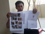 eko-purnomo-tunjukkan-sertifikat-tanah_20180911_071313.jpg