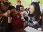 ekpresi-pelajar-sdn-saat-disuntik-imunisasi-mr_20170822_203910.jpg