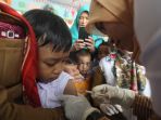 ekpresi-pelajar-sdn-saat-disuntik-imunisasi-mr_20170822_203912.jpg