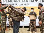 erick-thohir-terima-baret-anggota-kehormatan-gp-ansor_20211128_205357.jpg