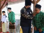 erick-thohir-terima-baret-anggota-kehormatan-gp-ansor_20211128_205424.jpg