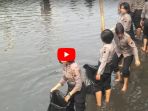 eringati-hari-air-sedunia-puluhan-polwan-cantik-nyebur-ke-sungai-untuk-bersihkan-sampah_20180321_124809.jpg