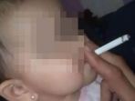 foto-bayi-merokok-yang-menghebohkan-lini-masa_20170809_123255.jpg