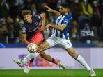 gelandang-atletico-madrid-spanyol-marcos-llorente-kiri-berebut-bola.jpg