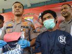 hariyanto-tersangka-begal-payudara-saat-dihadirkan-polisi-dalam-jumpa-pers.jpg