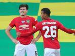 harry-maguire-dan-mason-greenwood-merayakan-gol-manchester-united.jpg