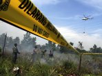 helikopter-water-bombing-padamkan-karlahut-di-pekanbaru_20160811_005857.jpg
