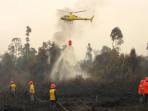 ilustrasi-pemadaman-kebakaran-hutan_20150714_100318.jpg