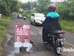 jalan-berlubang-di-kota-malang-yang-dipasangi-spanduk-capres-cawapres-01.jpg