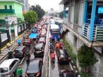 jalan-mampang-prapatan-jakarta-macet-usai-hujan_20210219_134656.jpg