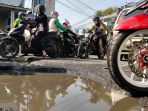 jalan-rusak-sumber-kemacetan-di-persimpangan-cangkuang_20220513_142205.jpg
