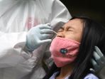 jelang-pembelajaran-tatap-muka-siswa-smp-di-surabaya-tes-swab_20201125_233744.jpg