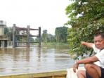 jembatan-melawi-ii-yang-mangkrak-8-tahun_20141217_200302.jpg