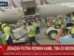 jenazah-eril-turun-dari-pesawat.jpg