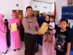 kapolres-ciamis-berikan-akta-kelahiran-dan-kia-gratis_20180908_104048.jpg
