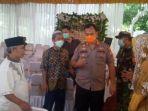 kapolsek-cisoka-akp-akbar-baskoro-bersama-jajarannya-membubarkan-acara-hajatan.jpg