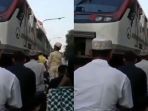 kereta-melintas-saat-warga-melaksanakan-salat-ied_20180822_194353.jpg