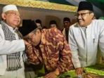 ketua-umum-pbnu-said-aqil-siradj-mencium-tangan-ketua-rois-am-nu-kh-maruf-amin_20170202_181337.jpg