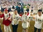 khofifah-indar-parawansa-dan-ketua-tim-kampanye-nasional-erick-thohir.jpg