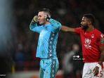 kiper-nottingham-forest-dean-henderson-merayakan-setelah-adu-penalti.jpg